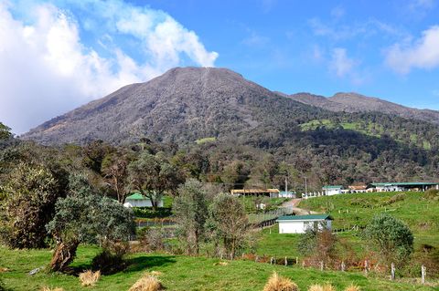 Turrialba Volcano looms over the village, gently steaming.